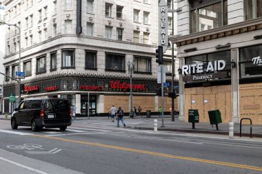 Los Angeles, CA/USA - June 1, 2020: Walgreens and Rite Ai  in downtown LA boarded up after the Black Lives Matter riots and looting on May 29th clipart