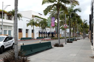 Beverly Hills, CA/USA -  June 6, 2020: Boarded up shops on Rodeo Drive after the Black Lives Matter protests where every store in the luxury shopping district was looted