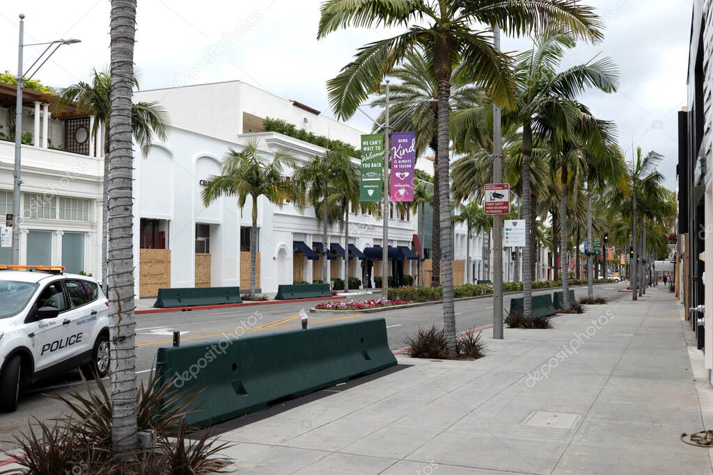 Beverly Hills, CA/USA -  June 6, 2020: Boarded up shops on Rodeo Drive after the Black Lives Matter protests where every store in the luxury shopping district was looted
