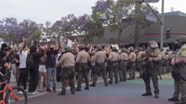 West Hollywood, CA/USA - June 4, 2020: Police form a barrier to Black Lives Matter protesters marching on San Vicente Boulevard