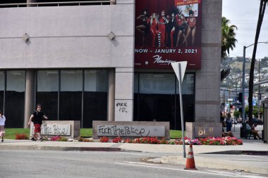 Los Angeles, CA/USA - May 30, 2020: Graffiti from the Black Lives Matter protest in West Los Angeles and Beverly HIlls covers buildings