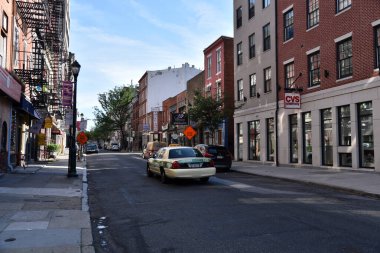 Philadelphia, PA/USA - June 26, 2019: A Taxi cab driving down a street in historic Old Towne Philadelphia