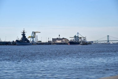 Philadelphia, PA/USA - June 26, 2019: The Battleship New Jersey and Ben Franklin Bridge seen from Old Towne Philadelphia