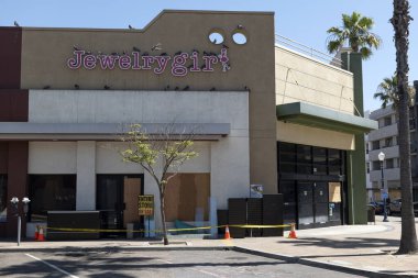 Long Beach, CA/USA - June 6, 2020: Jewelry store that was looted during the Black Lives Matter protests with an Entire Store on Sale sign in window