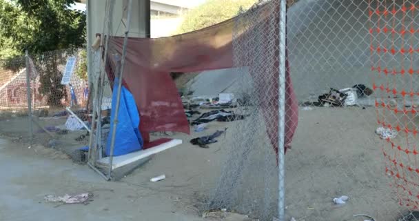 Hole Fence Leading Homeless Encampment Bridge — Stock Video