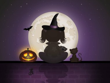 Cadılar Bayramı gecesi duvarda oturan kız