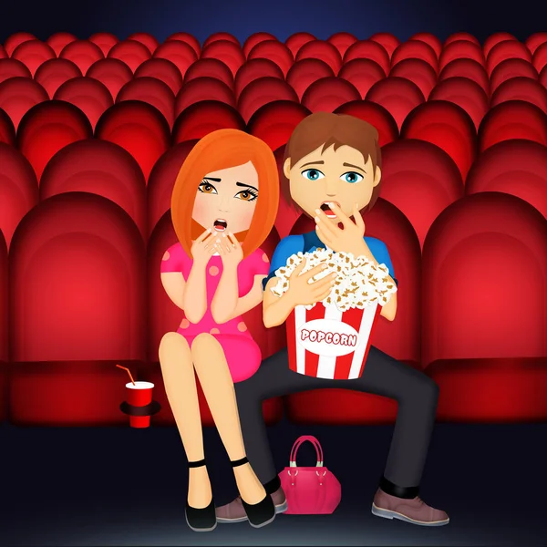 couple is watching a horror movie in a cinema