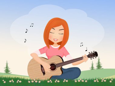 Kız çayırda oturup gitar çalıyor