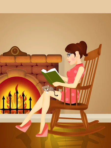 woman reads a book in front of the fireplace