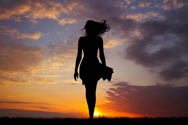 woman with skirt and hair in the wind