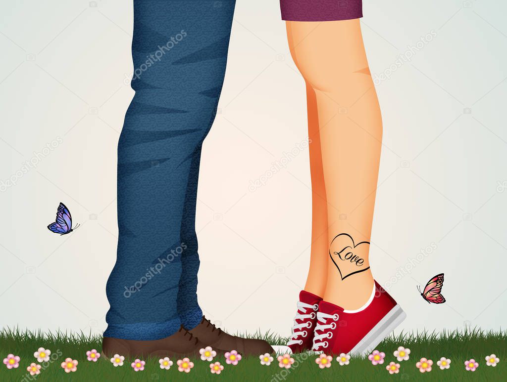 kissing man and woman legs in the meadow