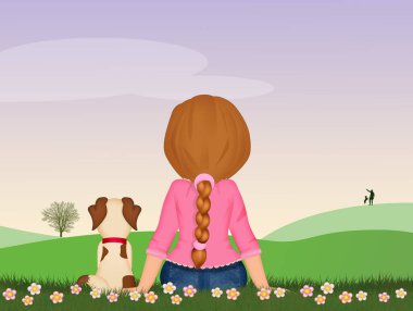 Küçük köpekli kız çayırda oturuyor.