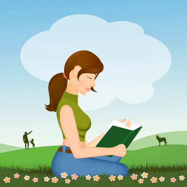 girl reads book sitting in the meadow