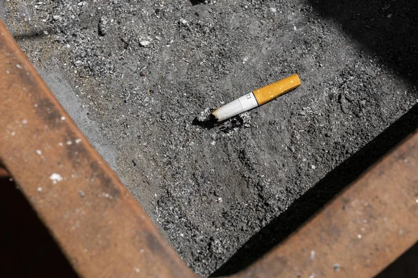 Many Cigarette butts in the dirty ashtray, Smoking is bad for your health.