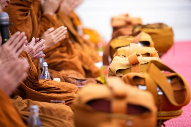 Pray of monks of buddhist in Thailand clipart