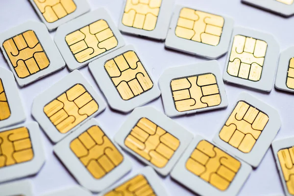 Many Micro SIM 3G for mobile over on white background.