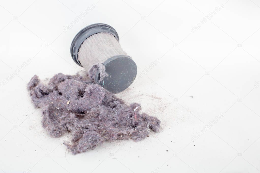 Common household dust on HEPA (High efficiency particulate air) filter from the vacuum cleaner. high angle view, isolated on a white background