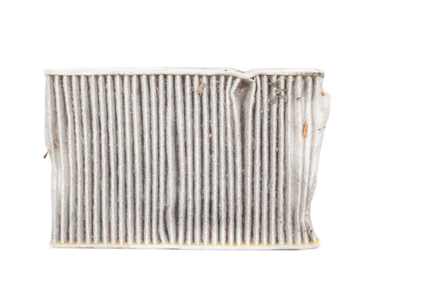 Changing a  car cabin pollen filter . High efficiety particle air filter.(Old one - front view) white background cutout