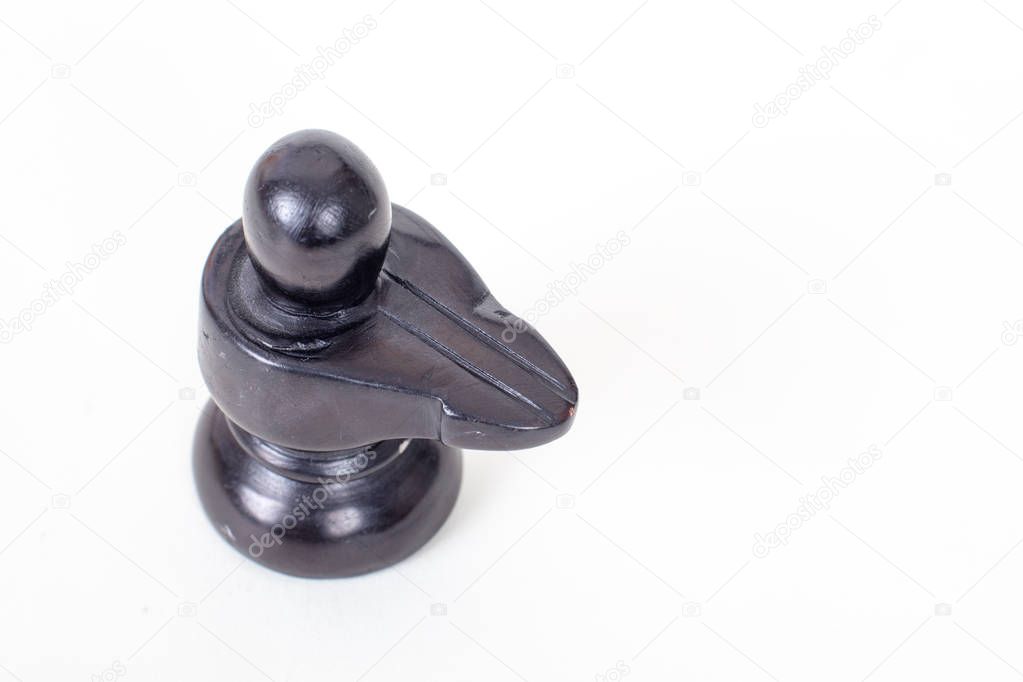 Handmade idol of Lord Shiva,   isolated on white. Lord Shiva is worshipped in the form of Shiv Lingam all across the India 