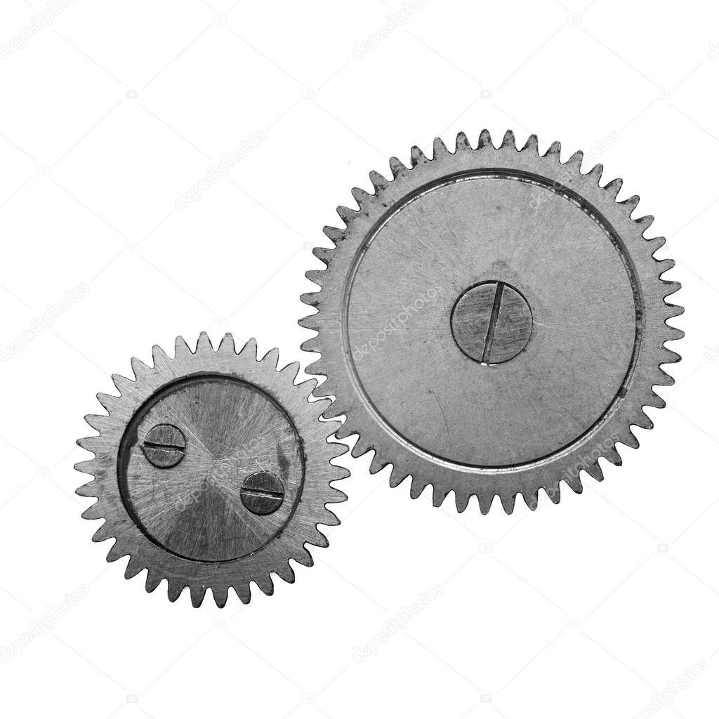 Metal gears isolated on white background. Black and white macro photo. Close-up part of clockwork. Concept Teamwork , Idea Technology and for other successful projects.