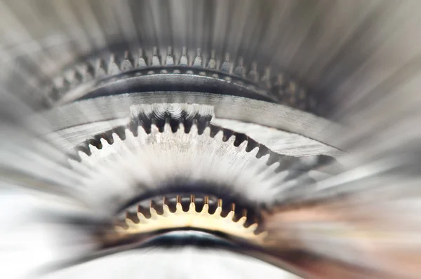 Metal Cogwheels in clock mechanism , abstract sun beams. Macro. — Stock Photo, Image