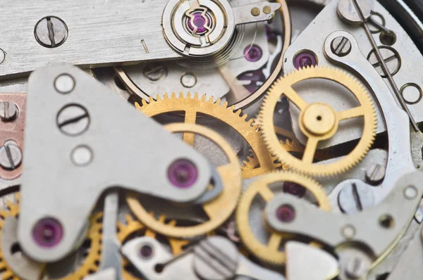 Relojes, engranajes en un viejo reloj. Concepto de trabajo en equipo, idea, techno —  Fotos de Stock