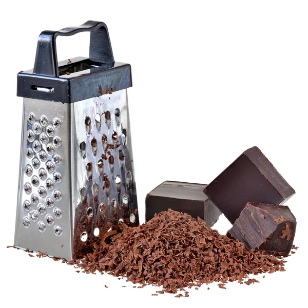 Chocolate ralado com um mini ralador isolado — Fotografia de Stock