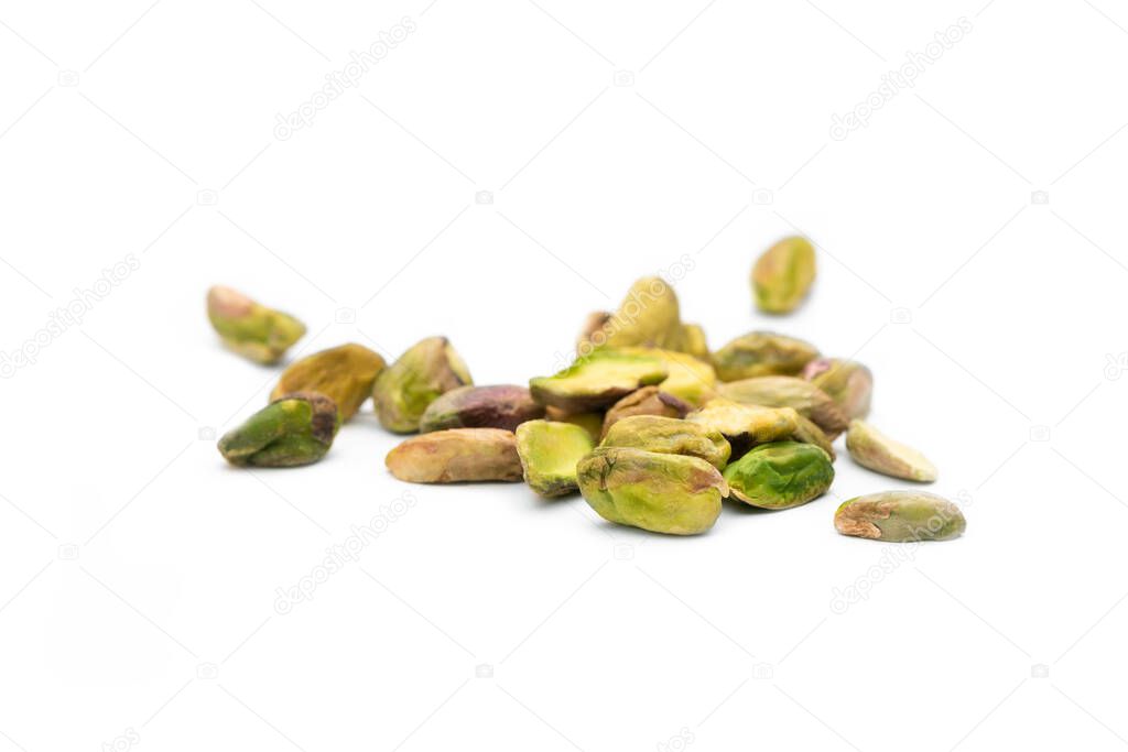 Group of peeled pistachios with white background