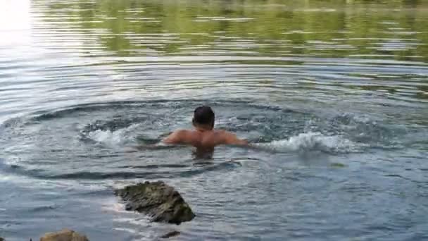 Man Bathes River — Stock Video