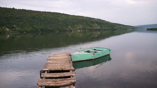 Lonely Boat Anchored Wooden Pier — Stock Video