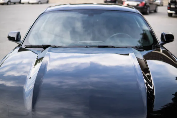 Sport gloss black car in the parking