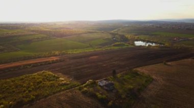 Sunset light over cultivating field in the spring. Moldova Republic of.
