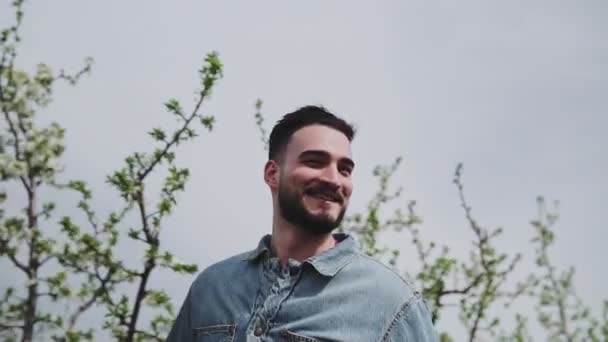 Young Guys Whiat Beard Walking Flowered Apple Orchard — 비디오