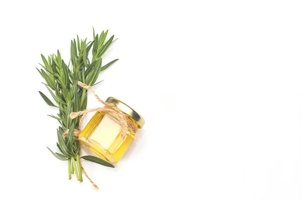 Bottle with essential oil and rosemary isolated on white background. — Stock Photo, Image