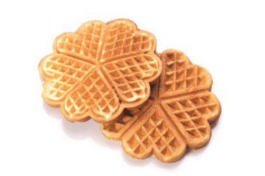 Beyaz arkaplanda taze pişmiş waffle 'lar.
