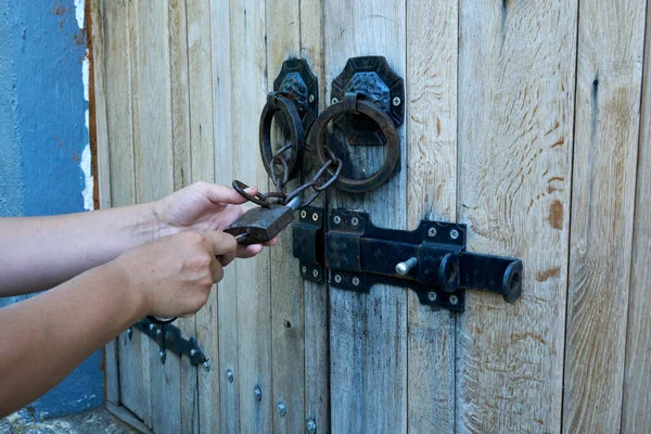 Women Opens Ancient Wooden Door Decorated Wrought Iron Elements Old — Stock Photo, Image