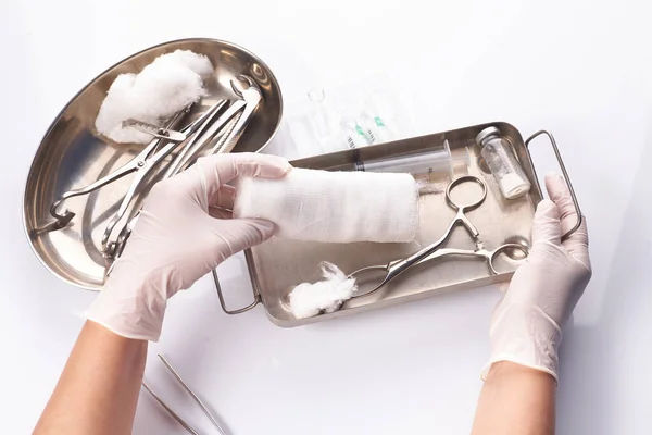 Dental appliances in sterile packaging. Dentists hand in gloves — Stock Photo, Image