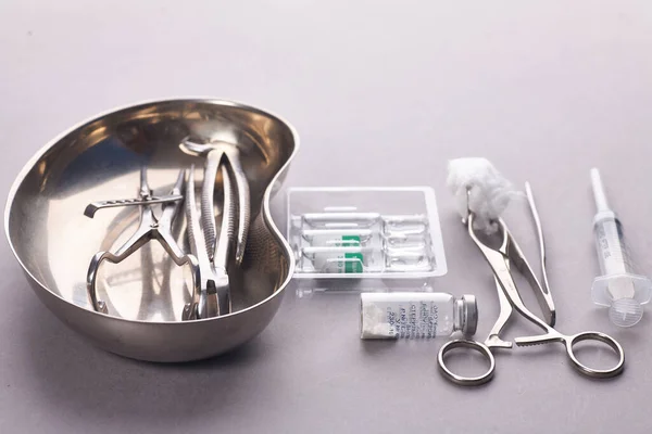 Dental appliances in sterile packaging on grey background..