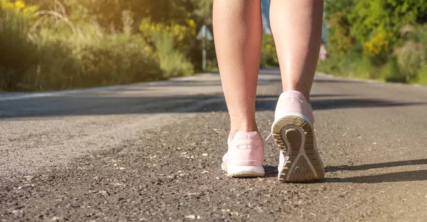 Women running sport feet on street in the park, healthy life style, jogging running exercise concept, banner