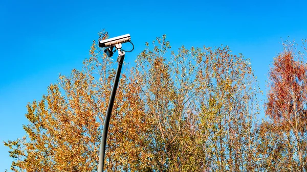 road surveillance camera on a background of the blue sky