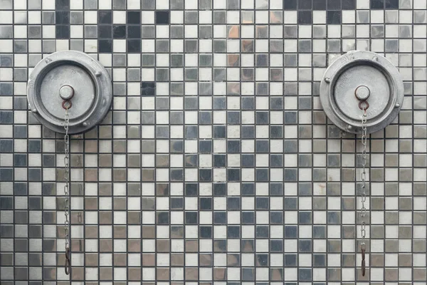 fire hydrants on the wall with mirrored mosaics day