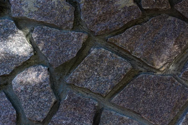 texture large gray stones fence day closeup