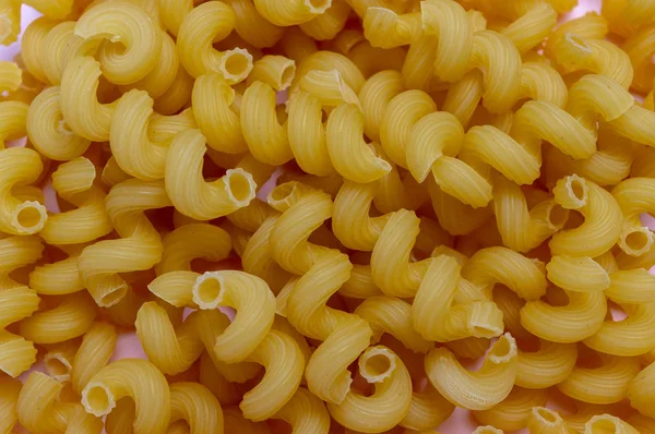 Textuur van pasta spiraal close up. Voedsel — Stockfoto