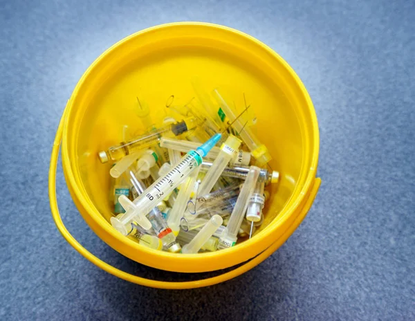 Medical waste in the trash bucket