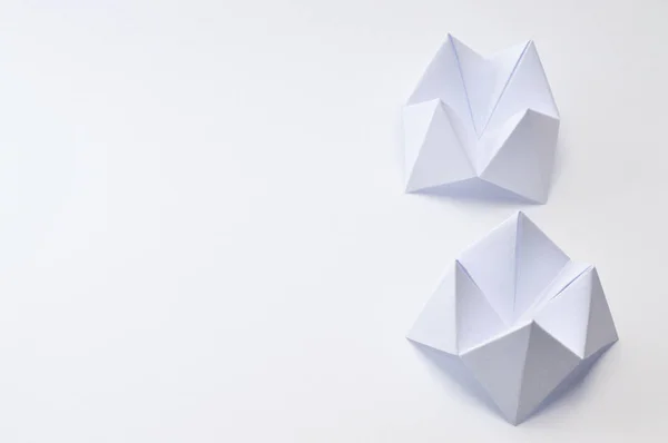 Origami figure paper in white background, ideal for your education projects or origami topics in your publications.