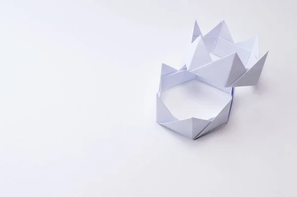 Origami figure paper in white background, ideal for your education projects or origami topics in your publications.