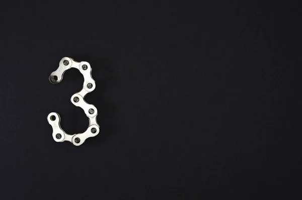 Iron bike chain showing numbers, ideal for your industry projects or mechanics publications.