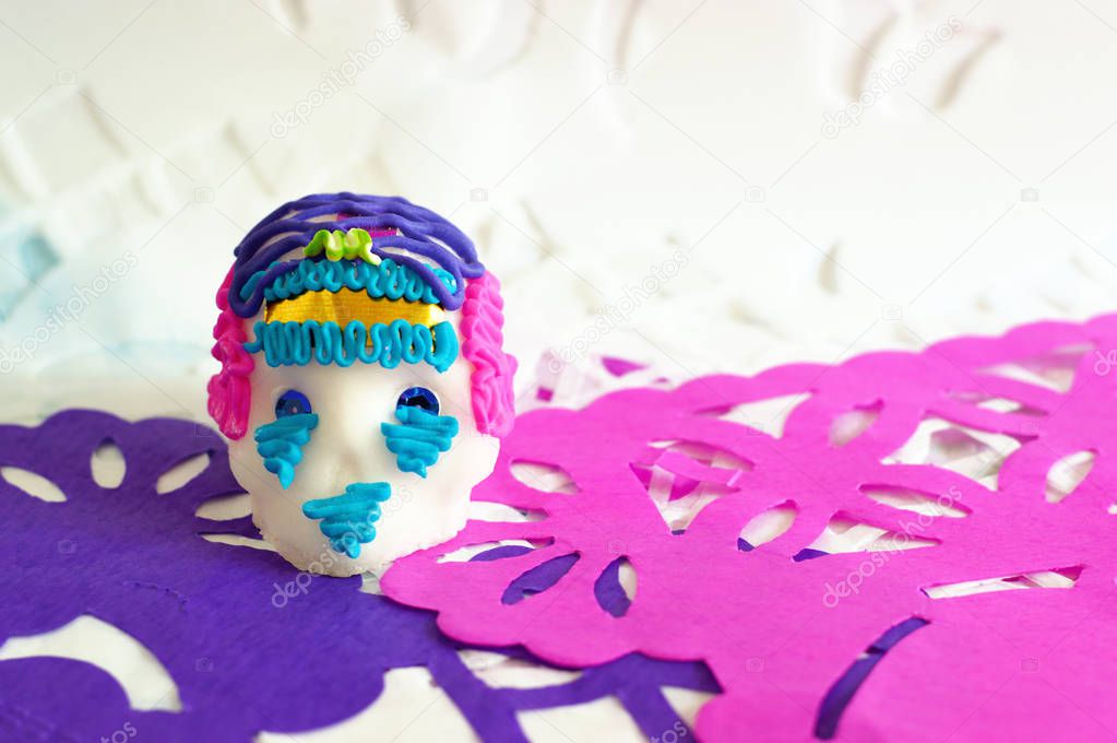 Traditional sugar skull on perforated paper of Day of the dead, ideal for your tradition and religion projects.