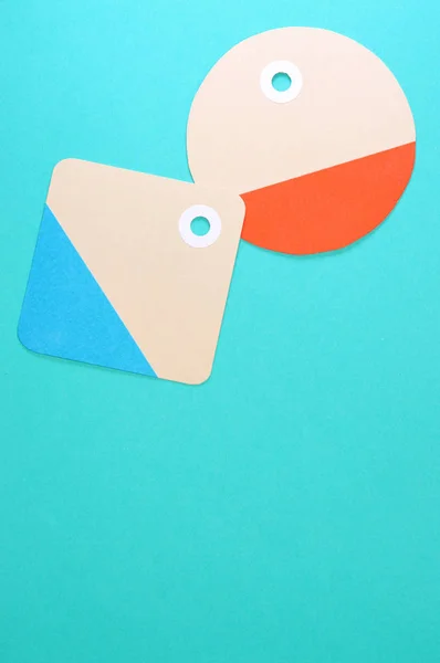 circle and square paper tags on blue background vertical templat