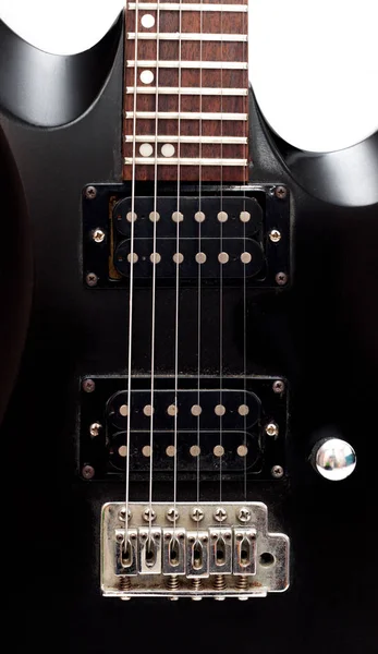 Guitarra preta sobre fundo branco — Fotografia de Stock